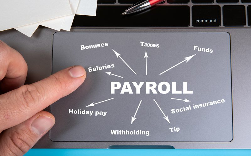 Tracking pad mouse with payroll list laid out on it